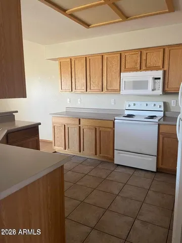 a kitchen with stainless steel appliances a stove a sink and a microwave