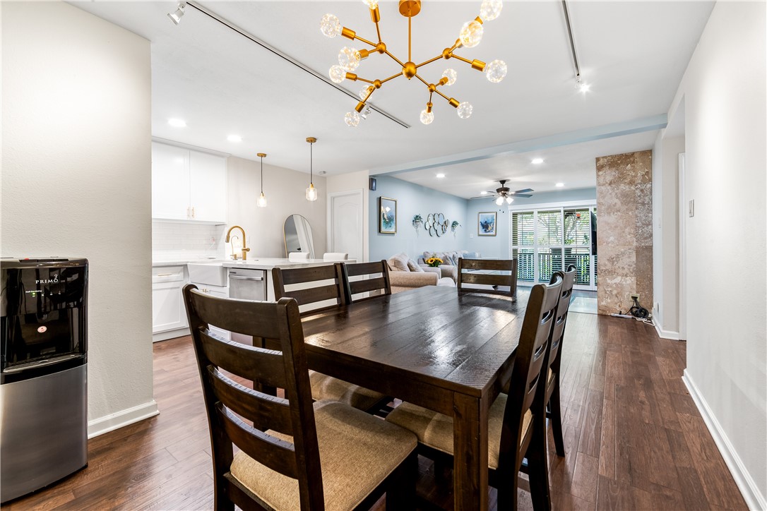 7890 East Spring Street, Unit 22F Long Beach, CA 90815 - Photo 12 of 60 a view of a dining room and livingroom with furniture