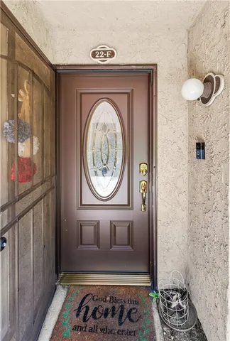 a view of a hallway with wooden floor and closet