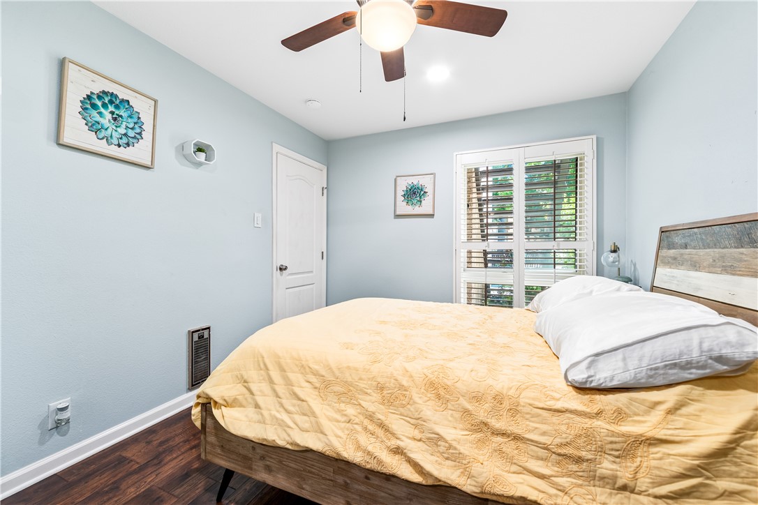7890 East Spring Street, Unit 22F Long Beach, CA 90815 - Photo 21 of 35 a bedroom with a bed and a window