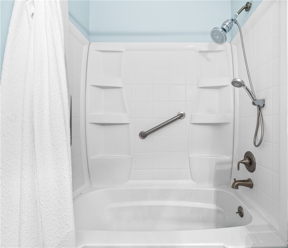 7890 East Spring Street, Unit 22F Long Beach, CA 90815 - Photo 24 of 35 a close view of a bathtub in bathroom