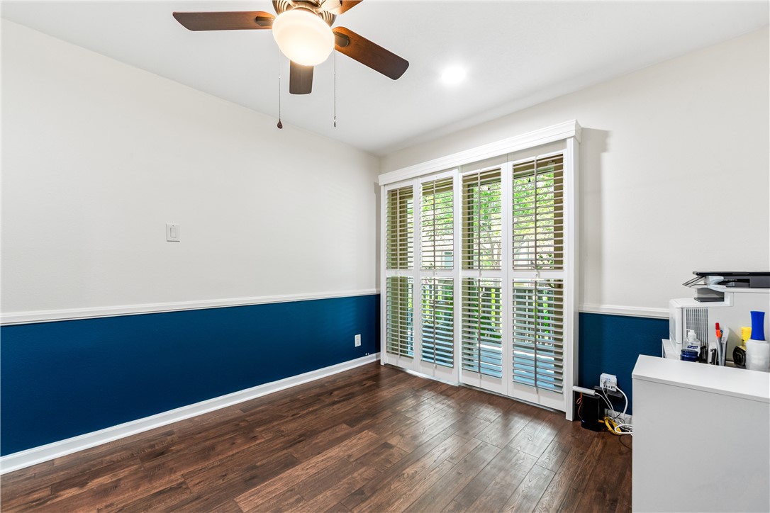 7890 East Spring Street, Unit 22F Long Beach, CA 90815 - Photo 25 of 35 an empty room with wooden floor and windows