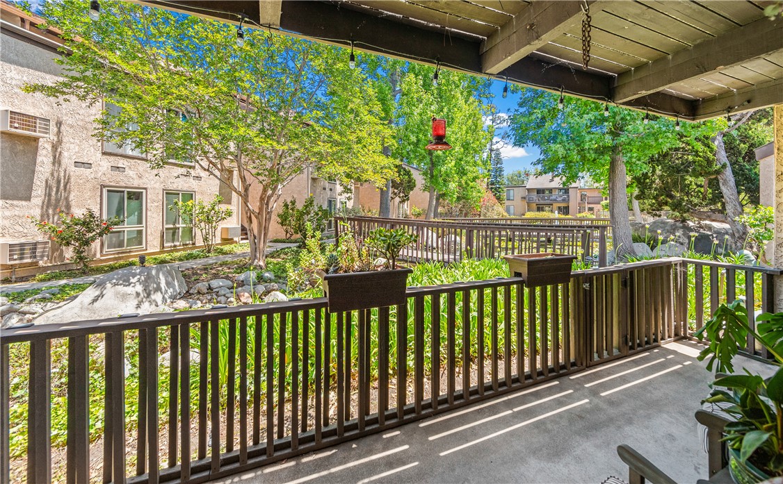 7890 East Spring Street, Unit 22F Long Beach, CA 90815 - Photo 28 of 35 a view of a street with a flower garden