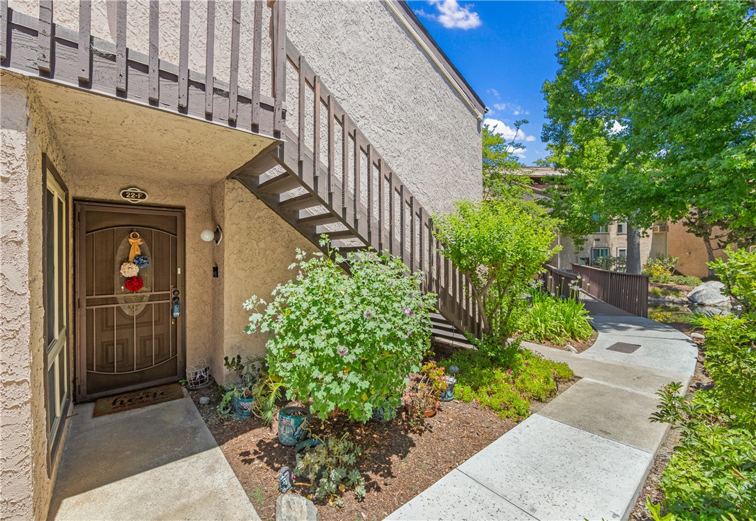 7890 East Spring Street, Unit 22F Long Beach, CA 90815 - Photo 29 of 35 a view of a house with flower plants