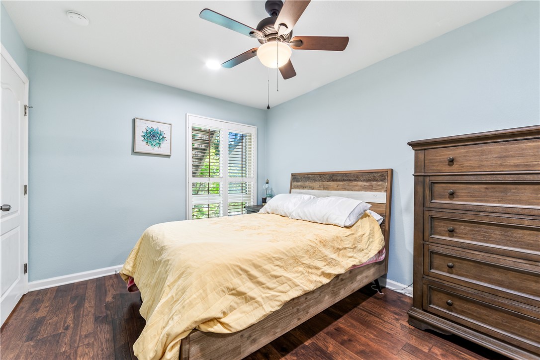 7890 East Spring Street, Unit 22F Long Beach, CA 90815 - Photo 34 of 60 a large bed sitting in a bedroom next to a window