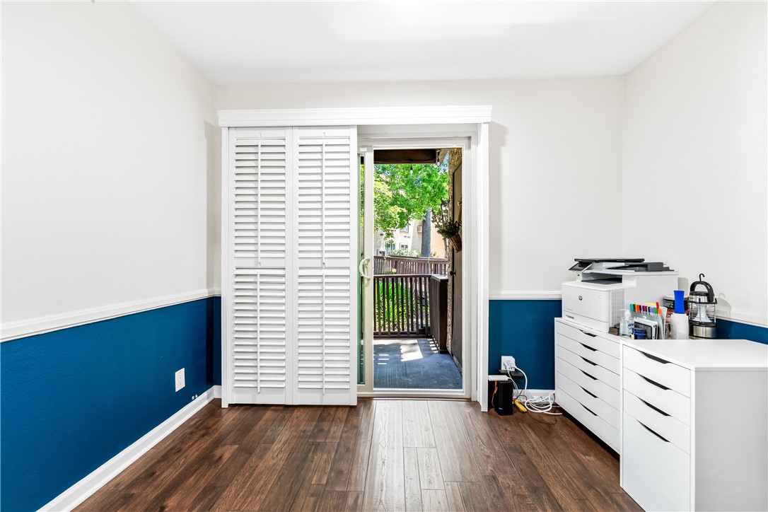 7890 East Spring Street, Unit 22F Long Beach, CA 90815 - Photo 43 of 60 a view of a kitchen with wooden floor and a window