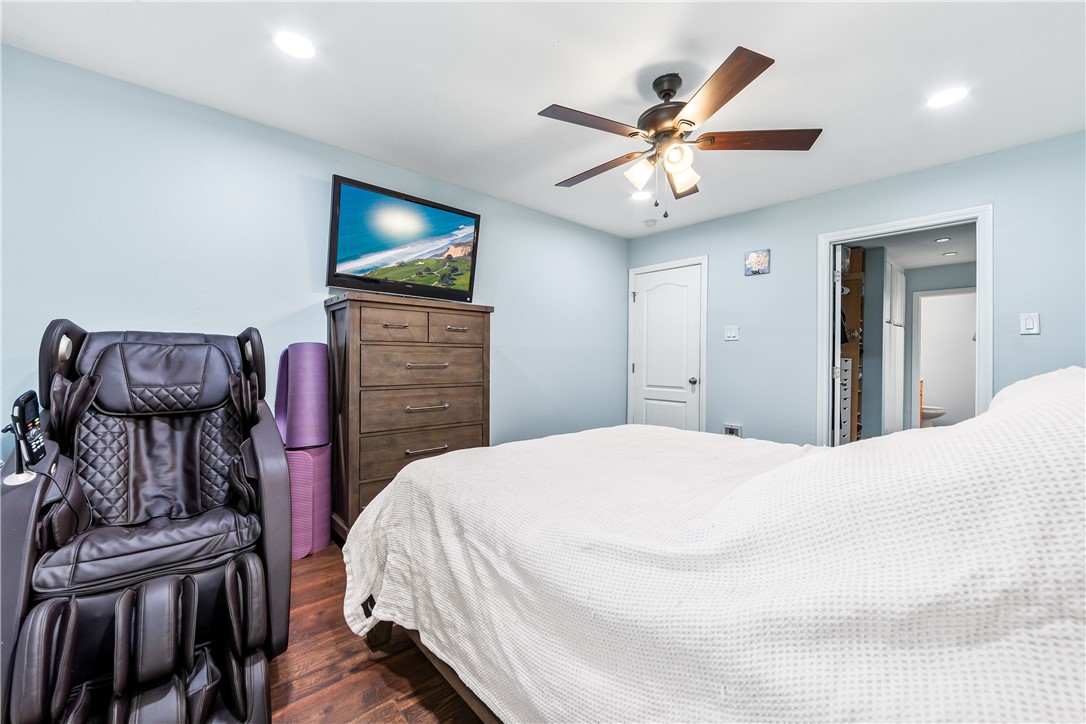 7890 East Spring Street, Unit 22F Long Beach, CA 90815 - Photo 47 of 60 a bedroom with a bed and a flat screen tv