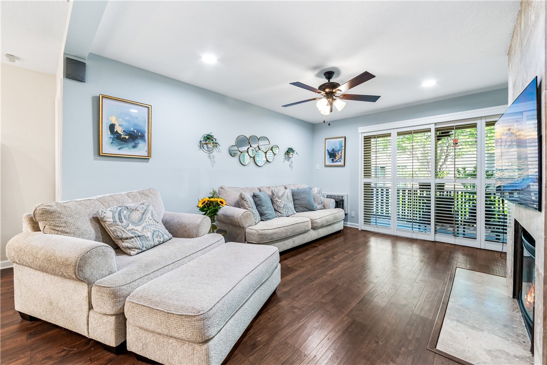 7890 East Spring Street, Unit 22F Long Beach, CA 90815 - Photo 5 of 60 a living room with furniture and a large window