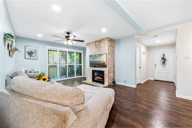 a living room with furniture and kitchen view