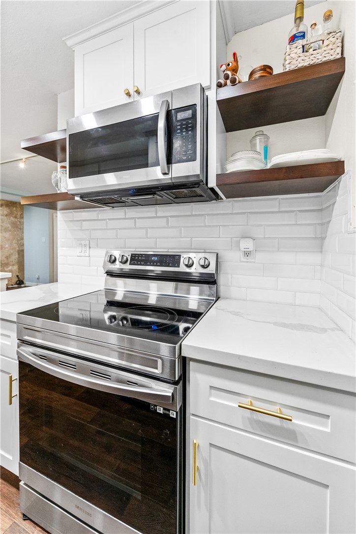 7890 East Spring Street, Unit 22F Long Beach, CA 90815 - Photo 7 of 35 a stove top oven sitting inside of a kitchen