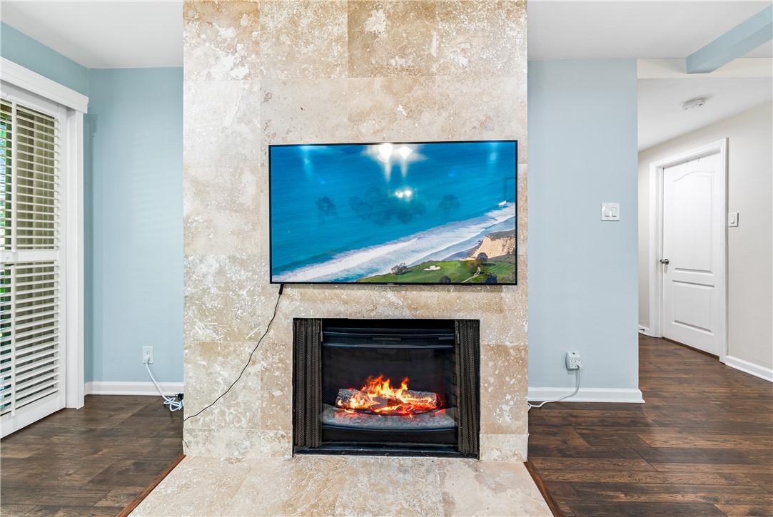 7890 East Spring Street, Unit 22F Long Beach, CA 90815 - Photo 10 of 60 a living room with furniture a fireplace and a fireplace