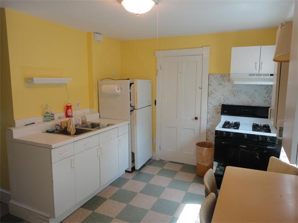 6 Eaton Street Wakefield, MA 01880 - Photo 4 of 11 a kitchen with a sink appliances and cabinets