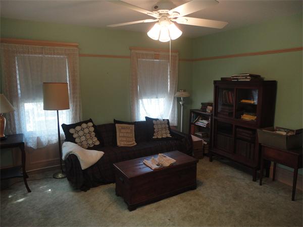 6 Eaton Street Wakefield, MA 01880 - Photo 6 of 11 a living room with furniture and a lamp