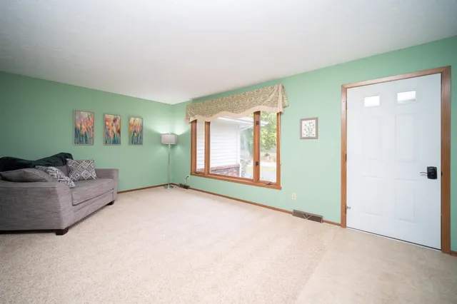 a view of livingroom with furniture and window