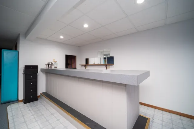 a kitchen with stainless steel appliances a sink and cabinets