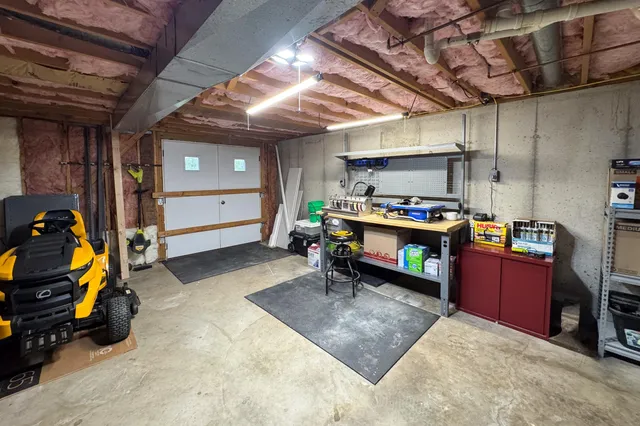 a room with furniture and a flat screen tv