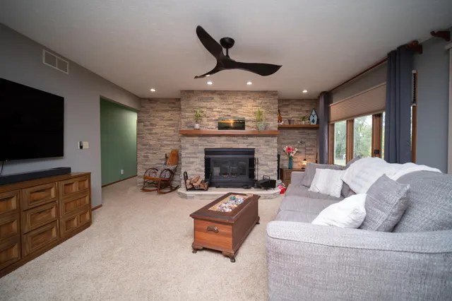 a living room with furniture and a fireplace