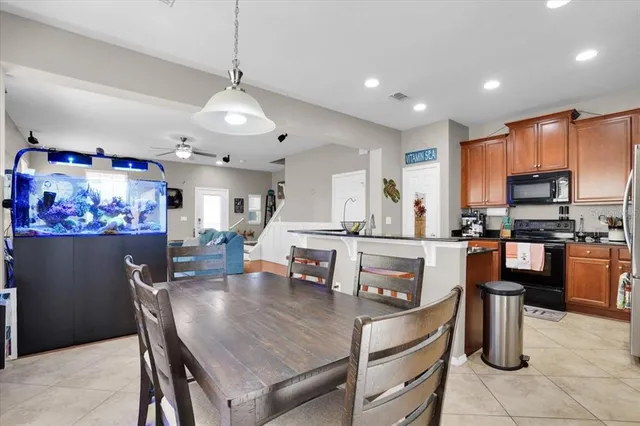 a dining table chairs and a kitchen view