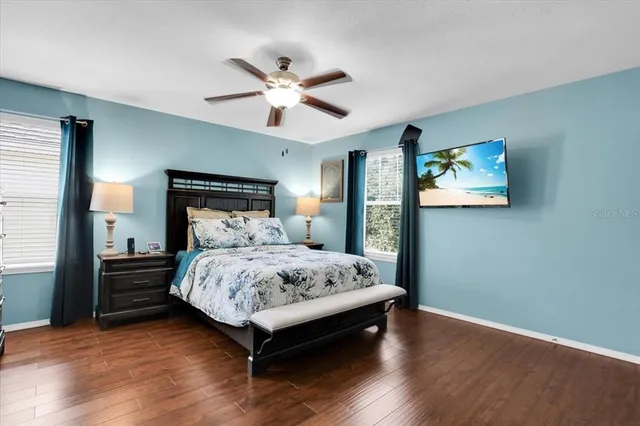 a bedroom with a bed and a chandelier