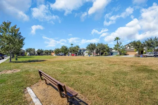a view of a garden with chairs