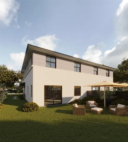 a kitchen with a table and chairs in it
