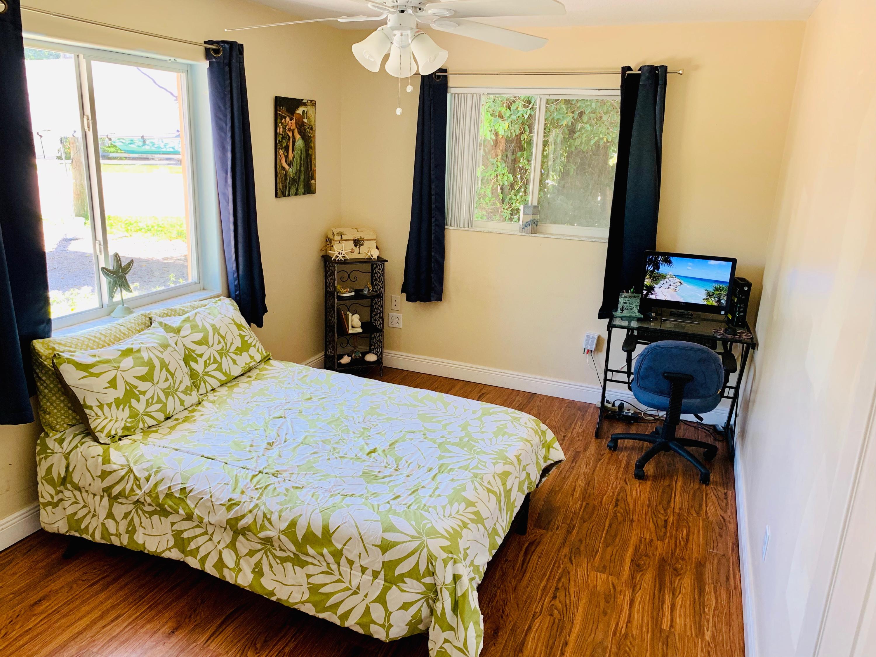46 Snapper Avenue Key Largo, FL 33037 - Photo 13 of 26 a bedroom with a bed and a window