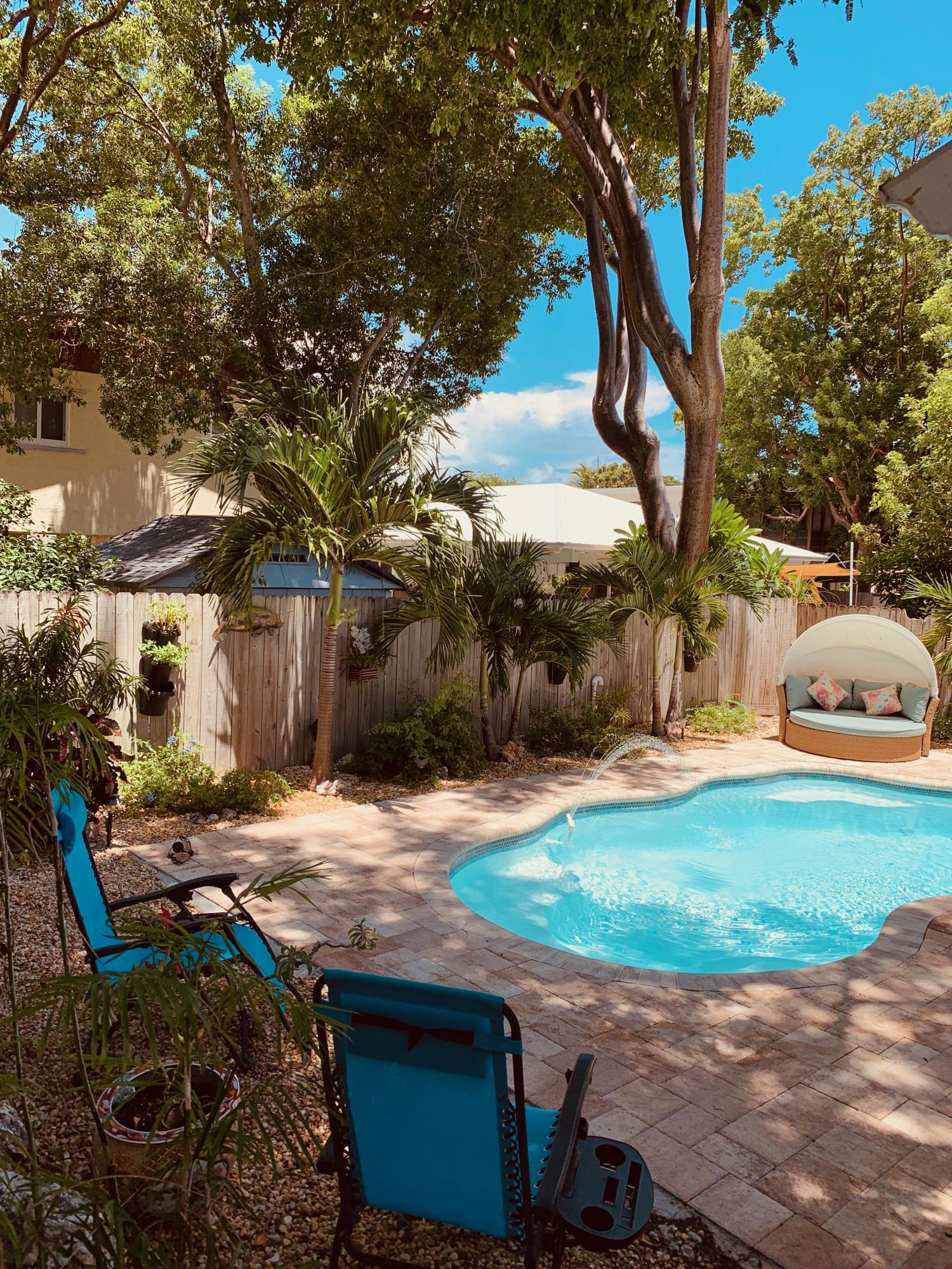 46 Snapper Avenue Key Largo, FL 33037 - Photo 18 of 26 a street view with large trees