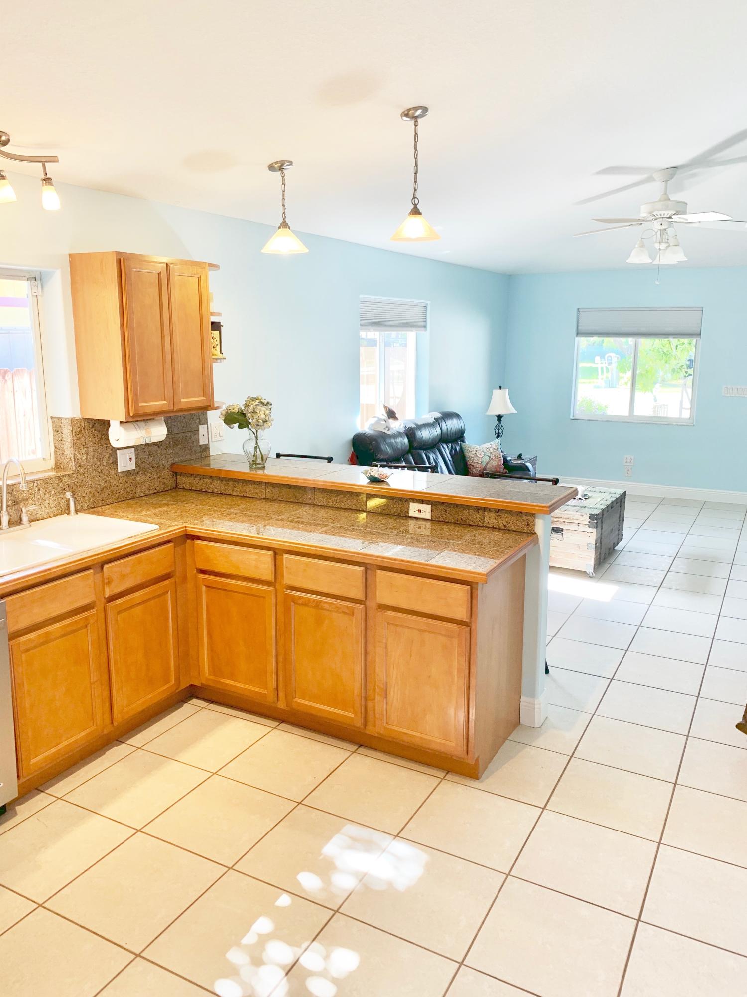 46 Snapper Avenue Key Largo, FL 33037 - Photo 6 of 26 a kitchen with stainless steel appliances granite countertop a sink and cabinets