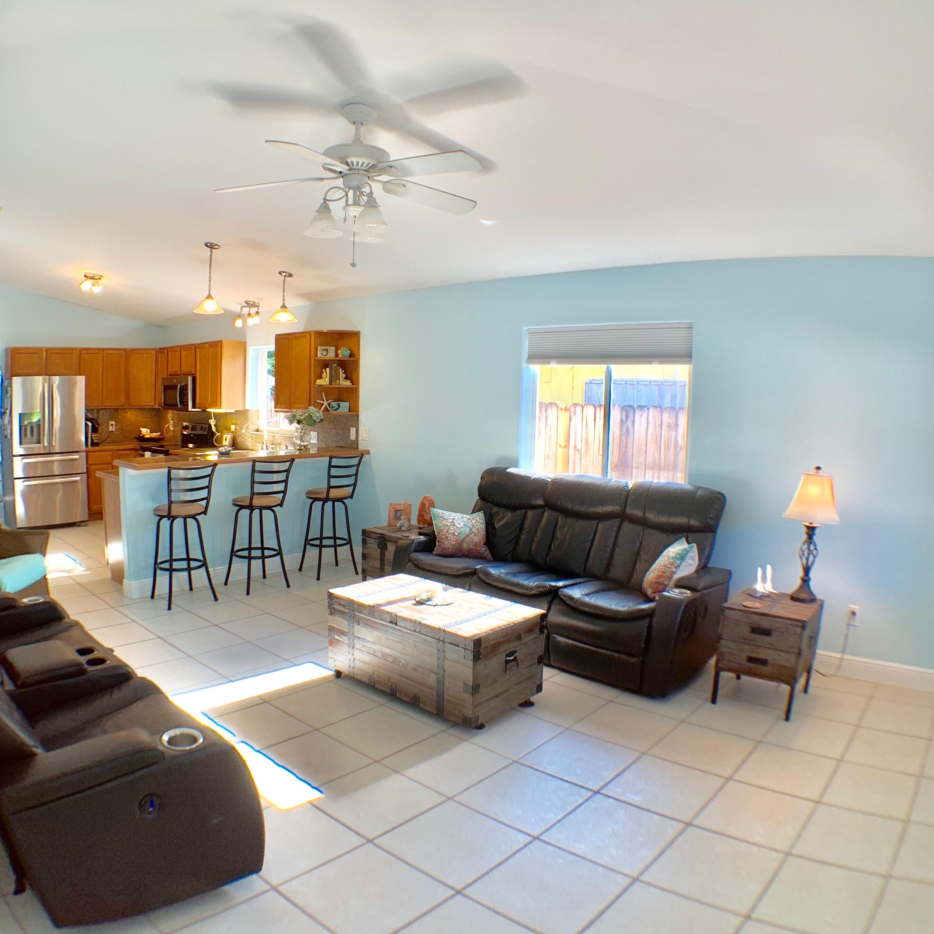 46 Snapper Avenue Key Largo, FL 33037 - Photo 7 of 26 a living room with furniture and a chandelier