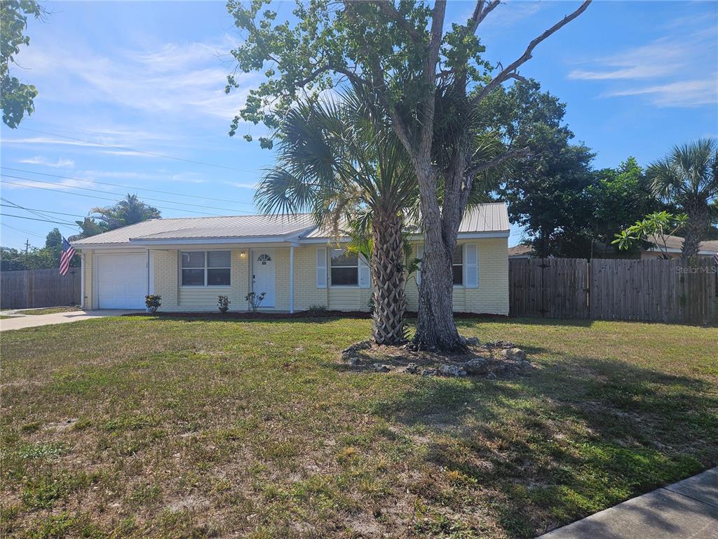 7000 Brentford Road Sarasota, FL 34241 - Photo 3 of 29 a view of a house with a yard
