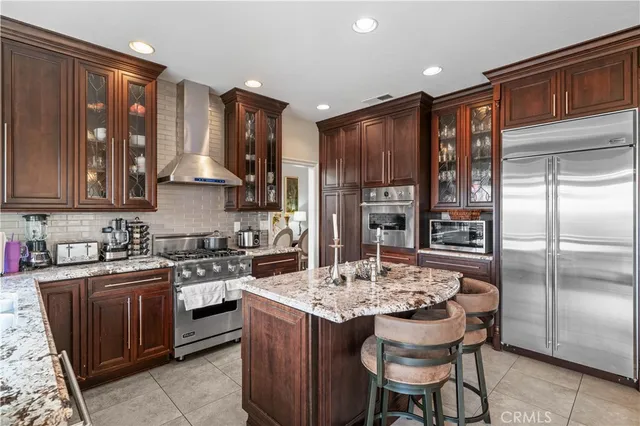 a kitchen with a sink stove and refrigerator