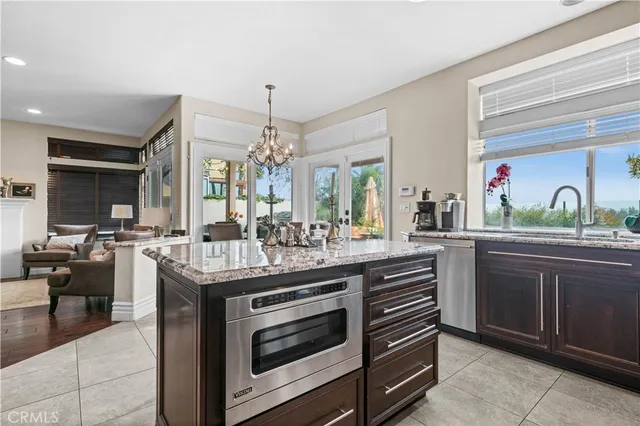 a kitchen with sink and cabinets