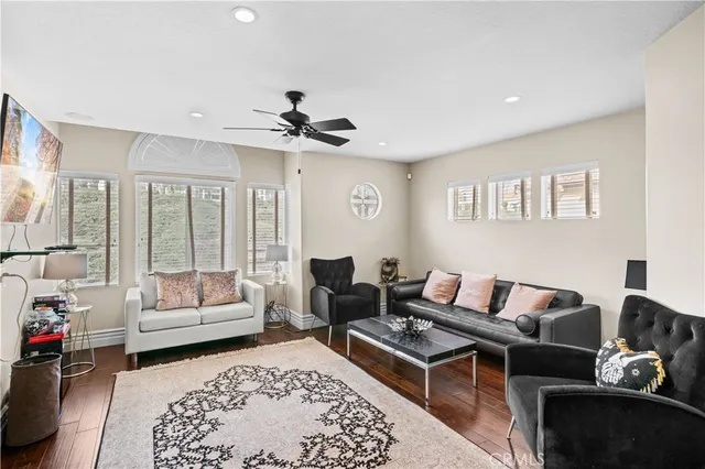 a living room with furniture and a rug