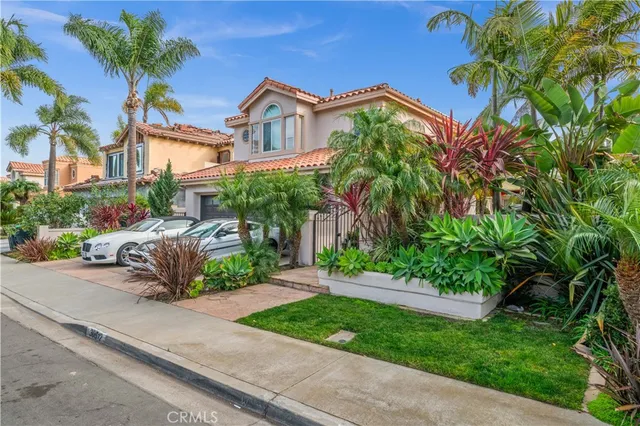 a view of a street with a cars park side of a road