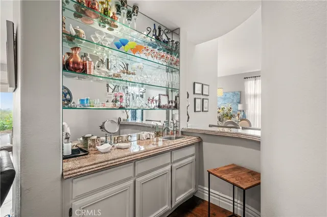 a kitchen with stainless steel appliances granite countertop a sink and cabinets