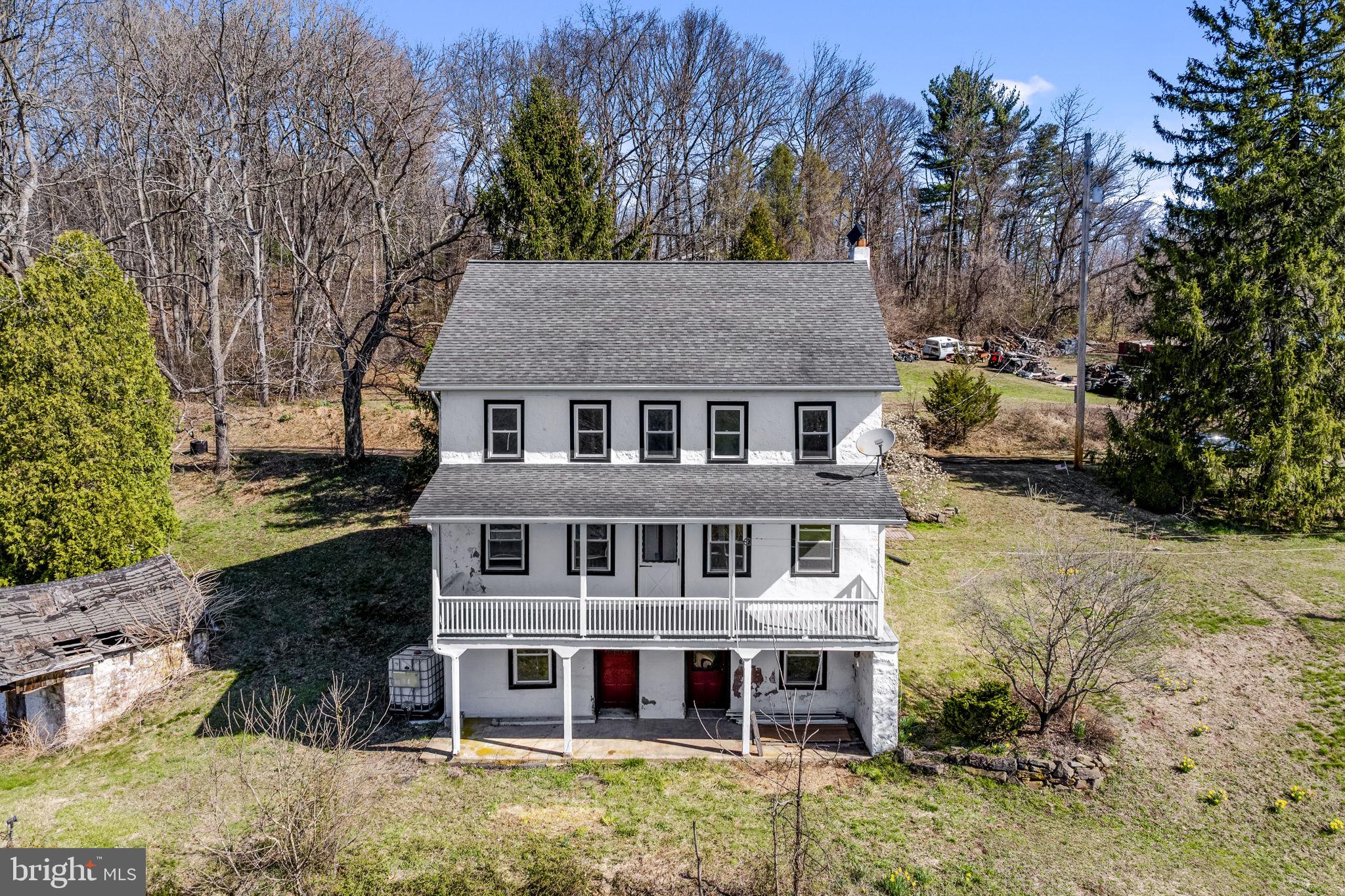 a view of a house with a yard front of house