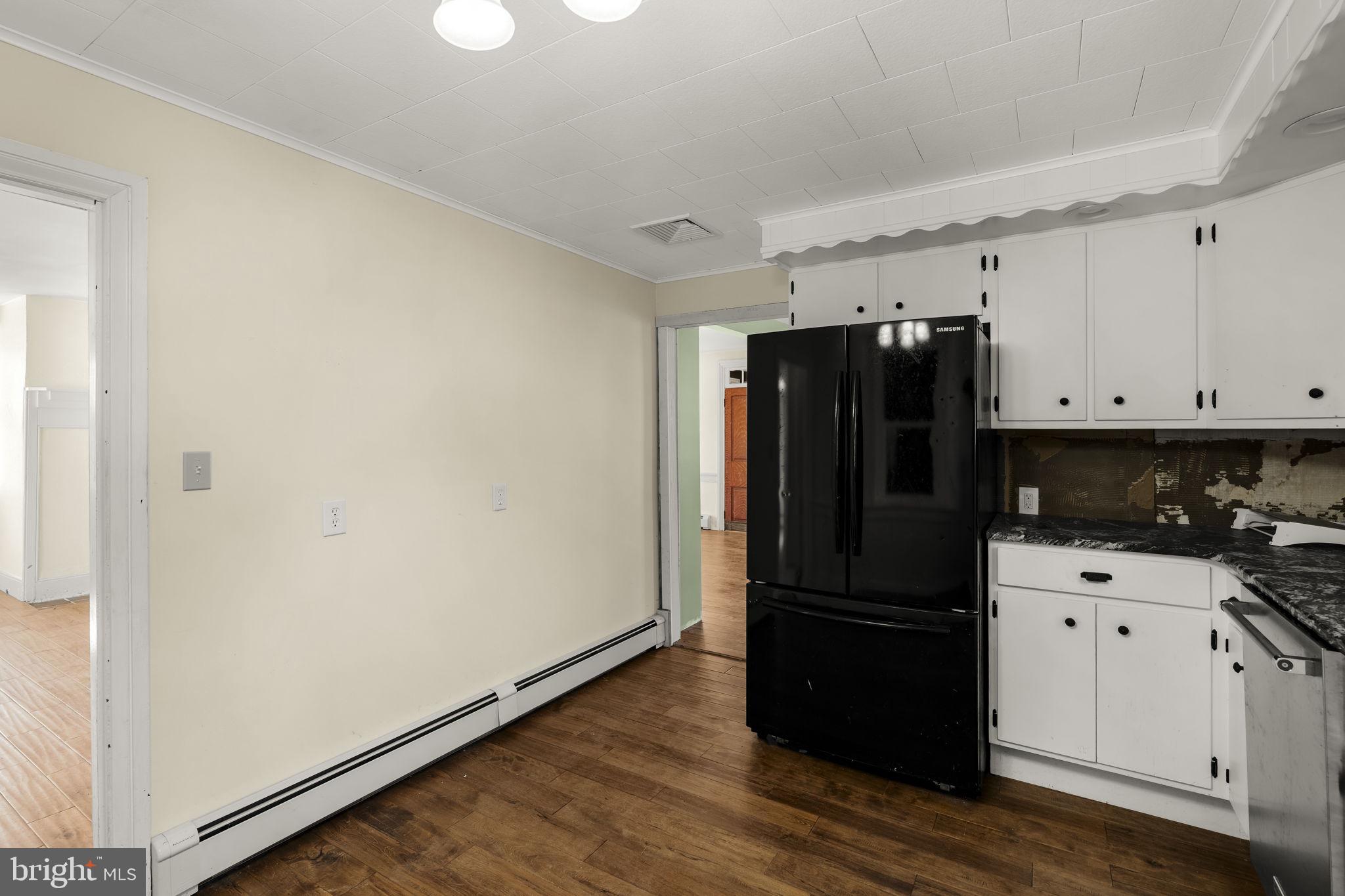 39 Gill Road Mohnton, PA 19540 - Photo 12 of 59 a kitchen with granite countertop white cabinets and refrigerator