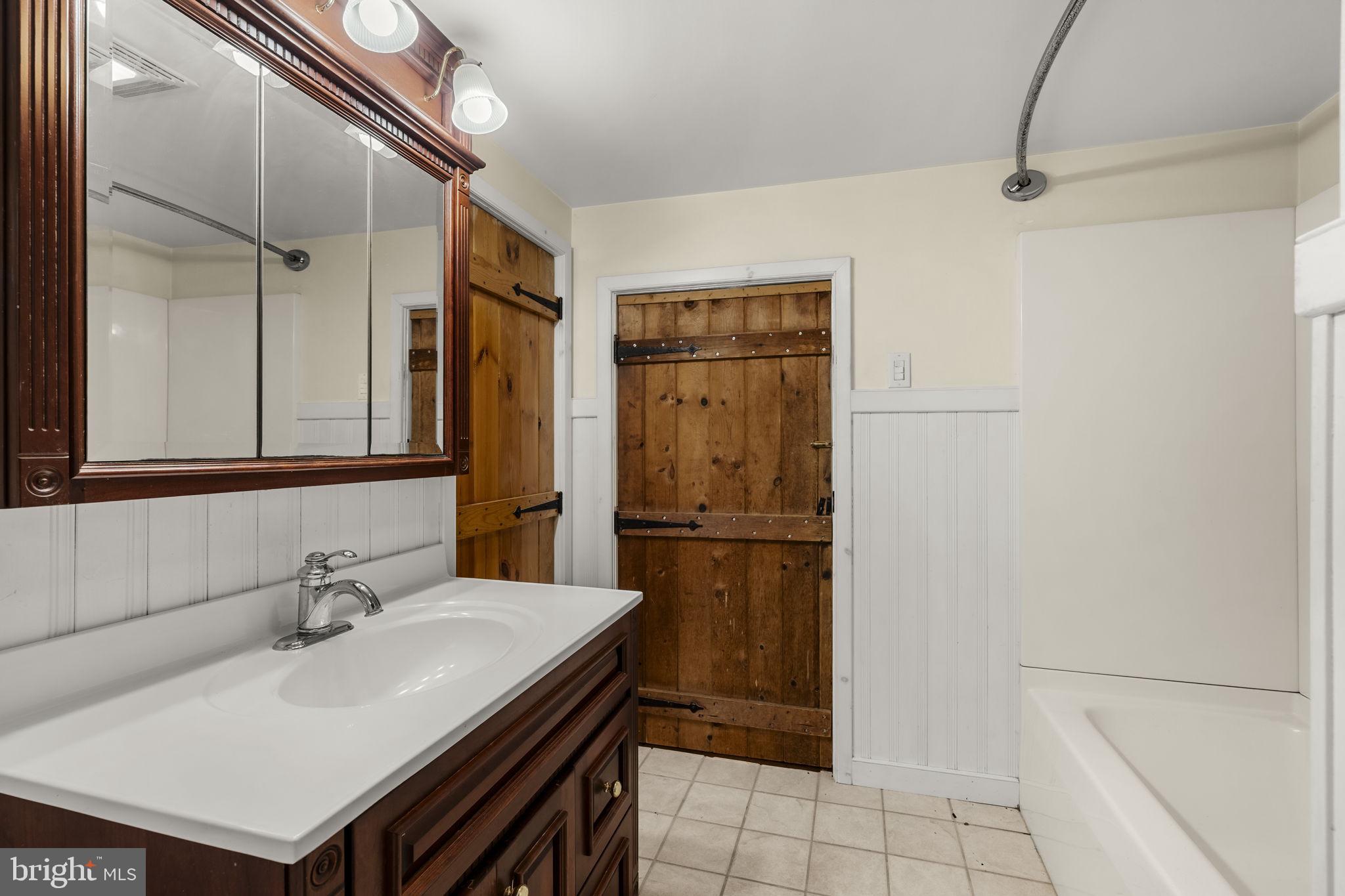 39 Gill Road Mohnton, PA 19540 - Photo 54 of 59 a bathroom with a sink a toilet and a mirror