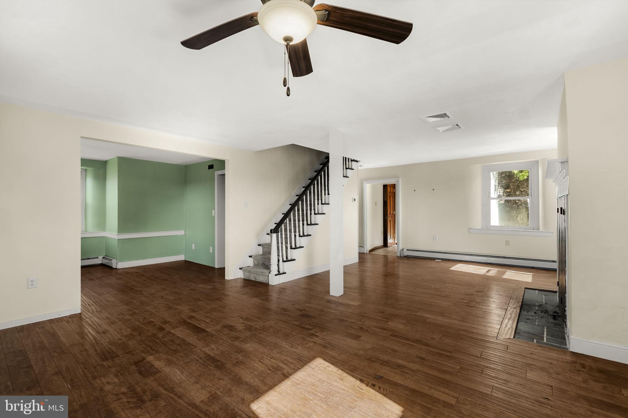 39 Gill Road Mohnton, PA 19540 - Photo 7 of 59 an empty room with wooden floor fan and windows