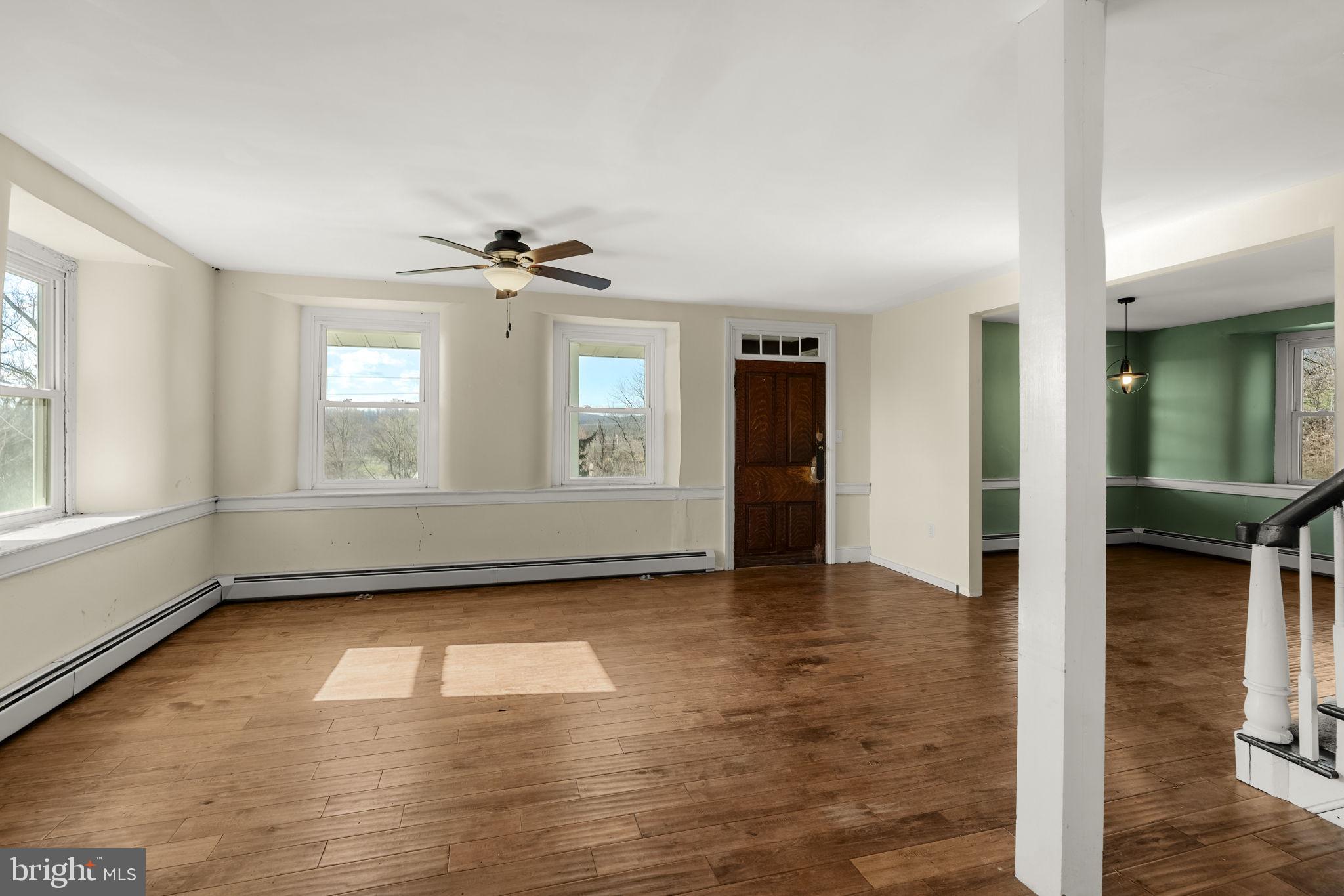 39 Gill Road Mohnton, PA 19540 - Photo 8 of 59 an empty room with wooden floor and windows