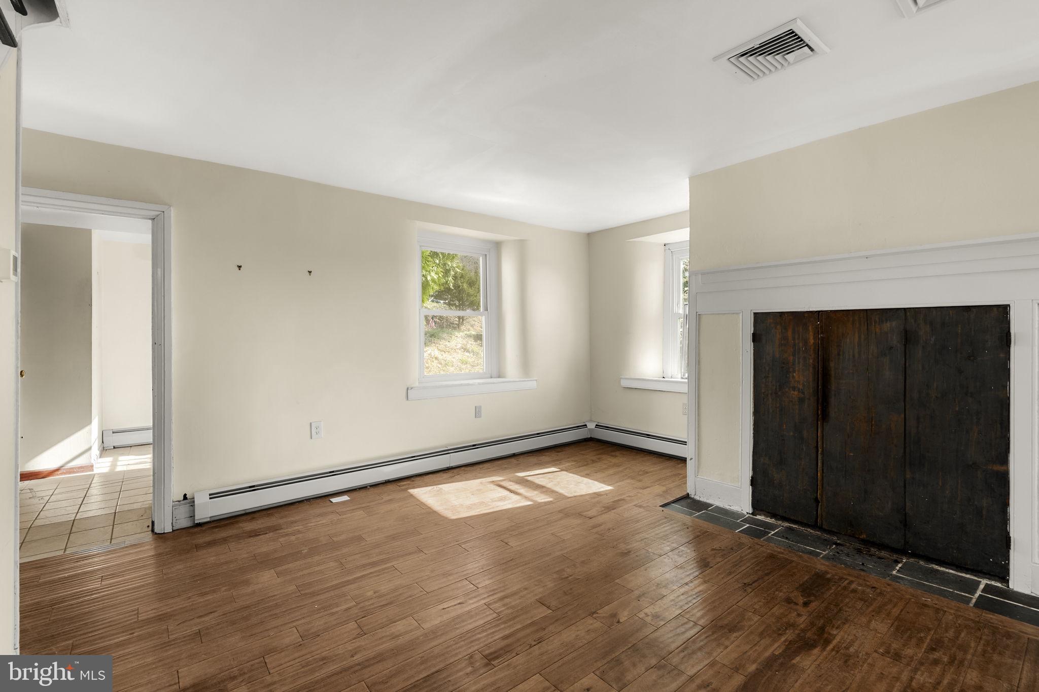 39 Gill Road Mohnton, PA 19540 - Photo 9 of 59 an empty room with windows and fireplace