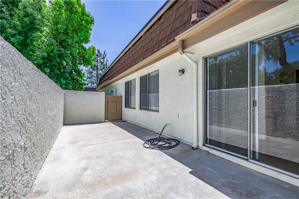10215 Larwin Avenue, Unit 4 Chatsworth, CA 91311 - Photo 12 of 38 a backyard of a house with seating space