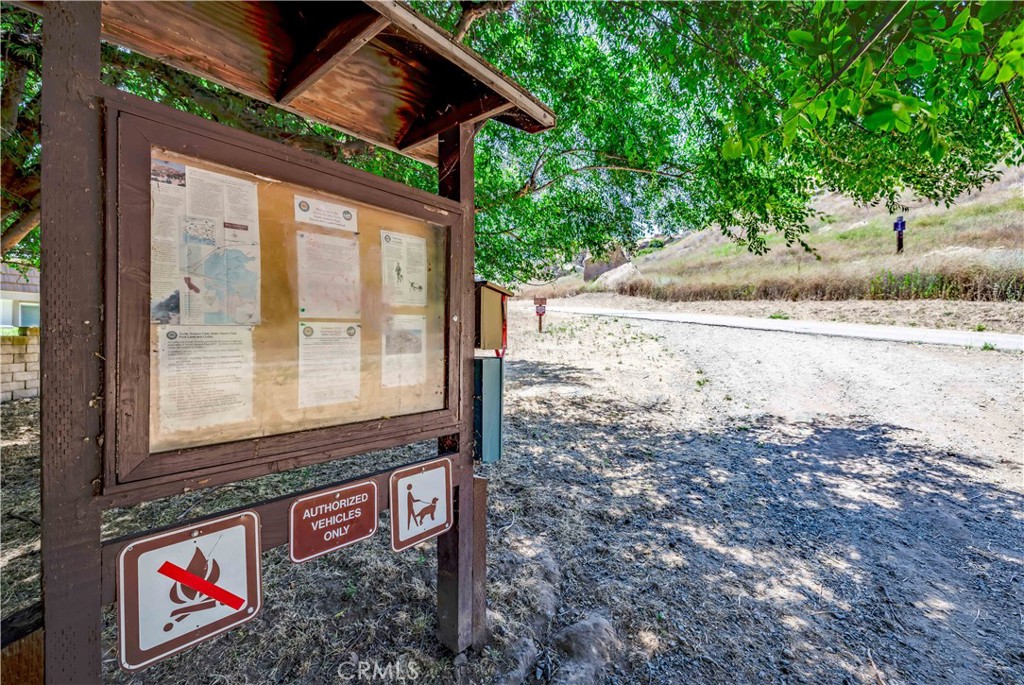 10215 Larwin Avenue, Unit 4 Chatsworth, CA 91311 - Photo 37 of 38 a wooden bench sitting in front of a house