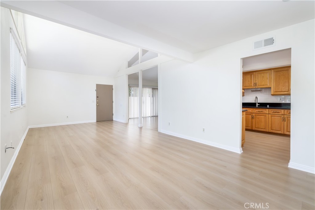 10215 Larwin Avenue, Unit 4 Chatsworth, CA 91311 - Photo 5 of 38 a view of a kitchen with a sink and a refrigerator