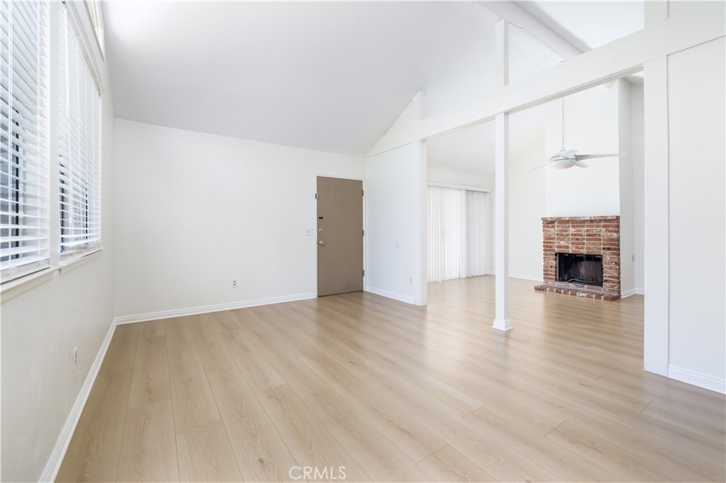 10215 Larwin Avenue, Unit 4 Chatsworth, CA 91311 - Photo 8 of 38 wooden floor in an empty room with a window