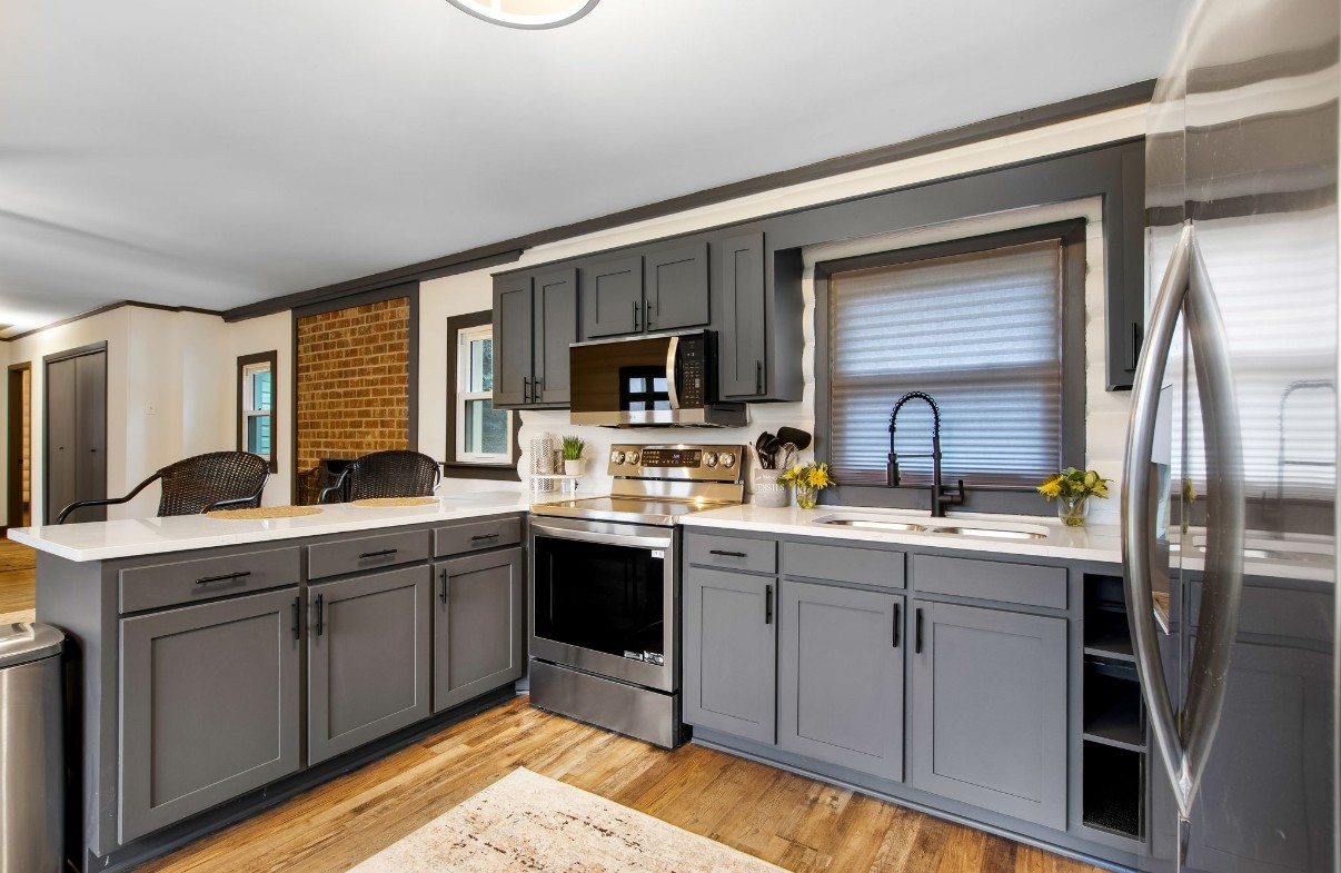 679 Alsup Mill Road Lebanon, TN 37090 - Photo 11 of 26 a kitchen with a sink stainless steel appliances and cabinets