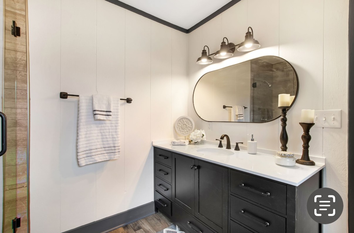 679 Alsup Mill Road Lebanon, TN 37090 - Photo 16 of 26 a bathroom with a sink and a mirror