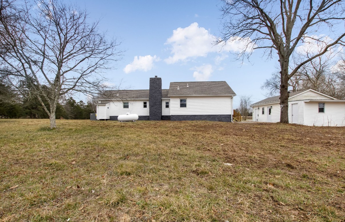 679 Alsup Mill Road Lebanon, TN 37090 - Photo 22 of 26 a front view of a house with a yard and covered with snow