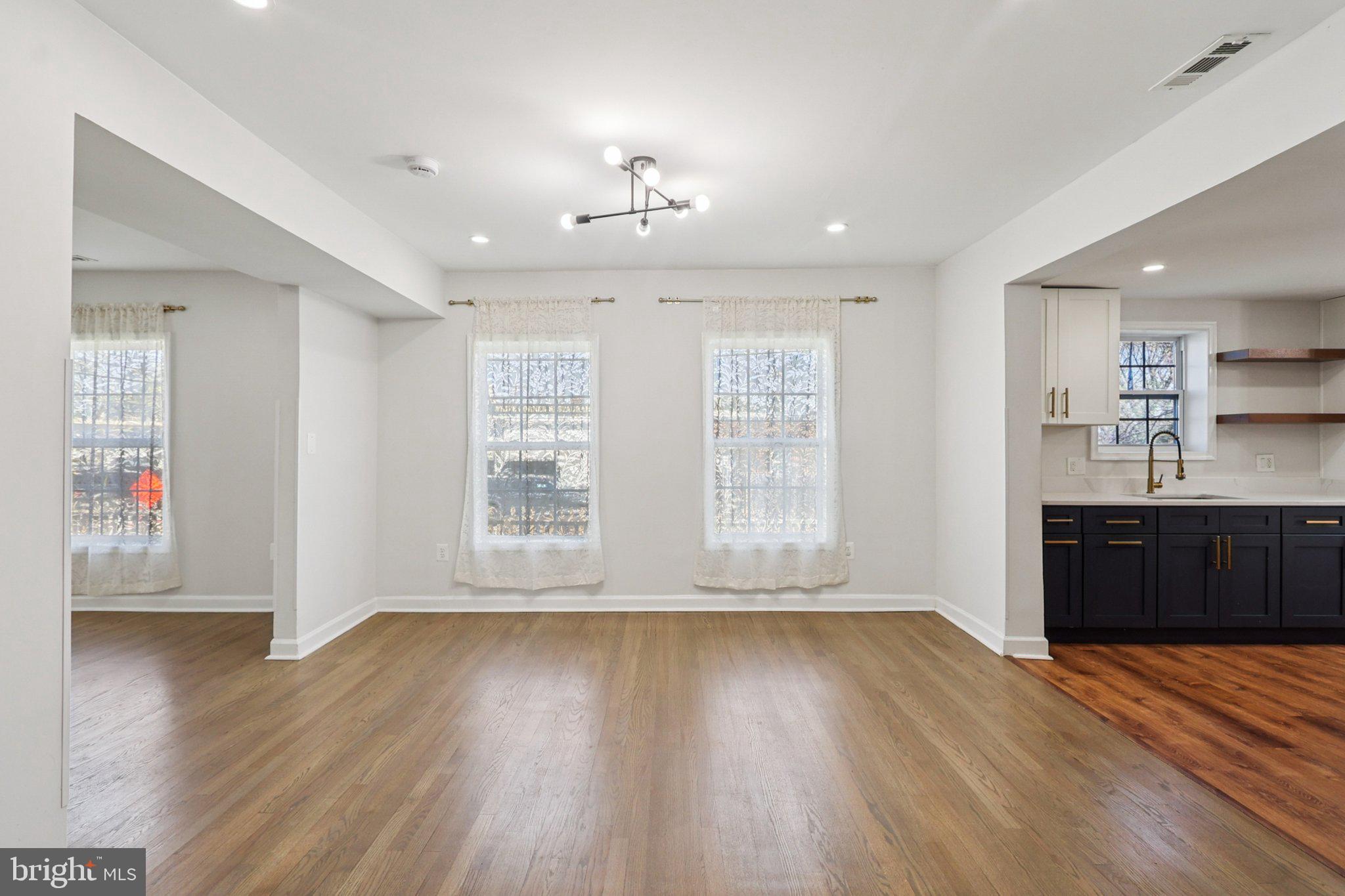 4357 Southern Avenue Southeast Capitol Heights, MD 20743 - Photo 18 of 84 a view of an empty room with wooden floor and a window
