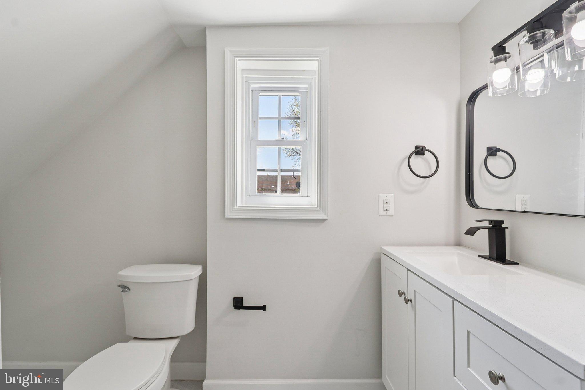 4357 Southern Avenue Southeast Capitol Heights, MD 20743 - Photo 50 of 84 a bathroom with a toilet sink and mirror
